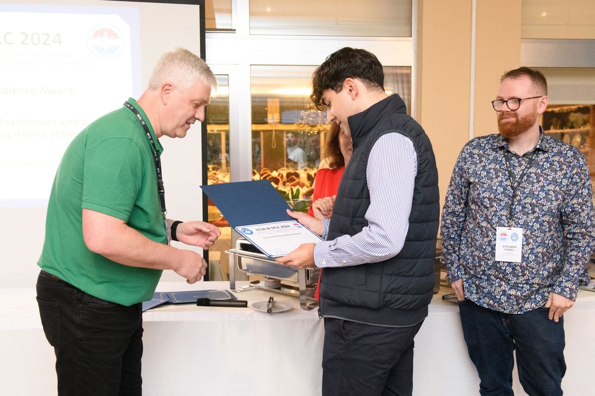 Alejandro receiving the Best Tool Presentation Award certificate at ECSA/SPLC 2024